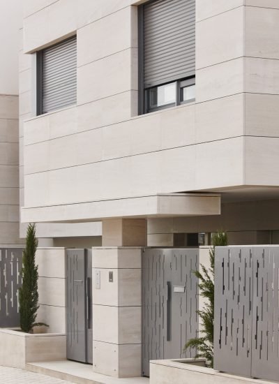 Modern residential building entrance. Estate property. Marble stone. Construction. Vertical